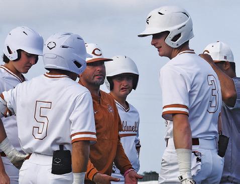 CALDWELL HEAD COACH Kyle Toney talks to his team between innings of a recent game. -- Tribune photo by Roy Sanders