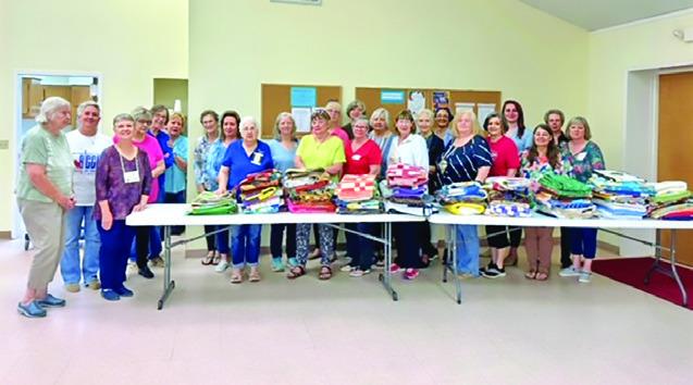 CREATIVE MEMORIES Quilt Guild donated 84 quilts to Brazos Valley Hospice on Wednesday April 24. Pictured are many members of the guild, along with Alexis Curley from Brazos Valley Hospice Brenham Office.