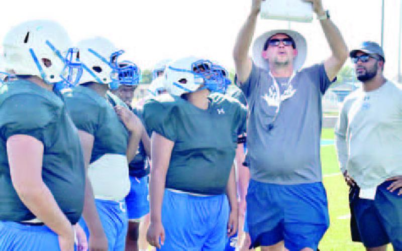 SNOOK HEAD COACH Dylan Conway goes over these plays with the Snook Bluejays during the Monday, Aug. 15, practice.