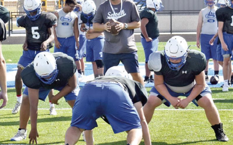 THE SNOOK BLEUJAYS led by head coach Dylan Conway go over their offensive plays during the Monday practice session.