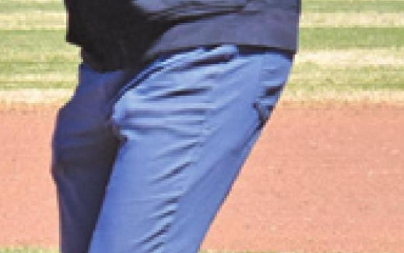 SOMERVILLE’S JEREMY FIKAC tosses out the first pitch for the RTC game last Wednesday. Fikac, a former Major League baseball player, was honored at the game. See more photos inside. -- Tribune photo by Roy Sanders