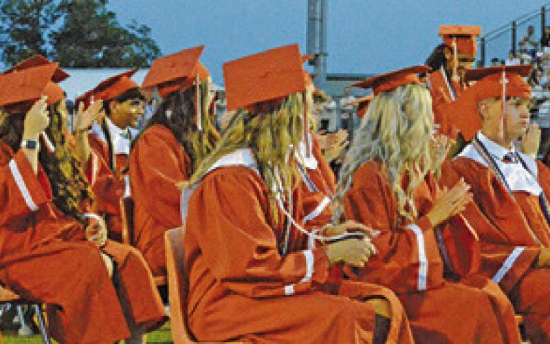 CALDWELL HIGH SCHOOL graduates celebrate during their commencement ceremony on Friday night, May 22, at Hornet Stadium. Tribune photo by Sabine Lazo