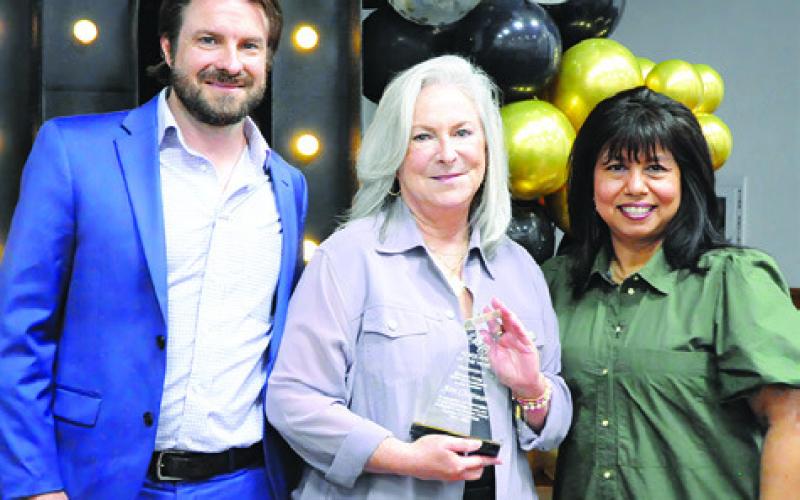 ANN CHAPMAN, CENTER, was honored as the chamber’s “Advocate of the Year” during the Burleson County Chamber of Commerce banquet last Thursday. Also pictured is Stu Chapman and Susan Mott. Tribune photo by Denise Squier