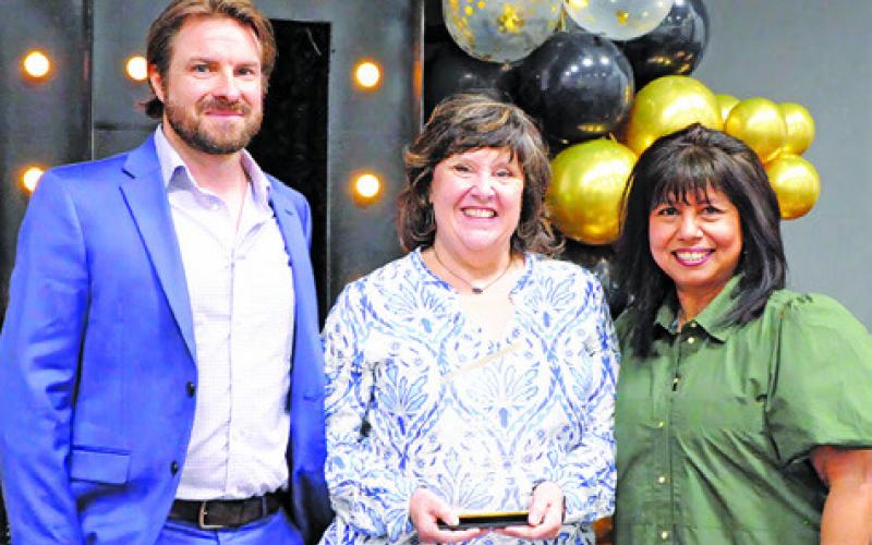 LIA ZACCAGNINO, CENTER, was honored as the chamber’s “Woman of the Year” during the Burleson County Chamber of Commerce banquet last Thursday. Also pictured is Stu Chapman and Susan Mott. Tribune photo by Denise Squier