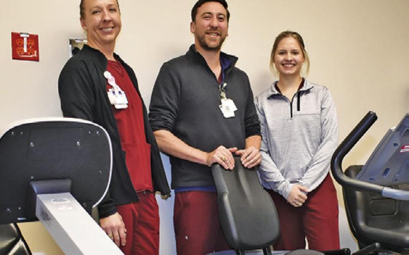 HOSPITAL STAFF MEMBERS are pictured in the cardiac rehab area. They include, from left, Anne Lockhart, Tim Reinberg and Tori Janak.