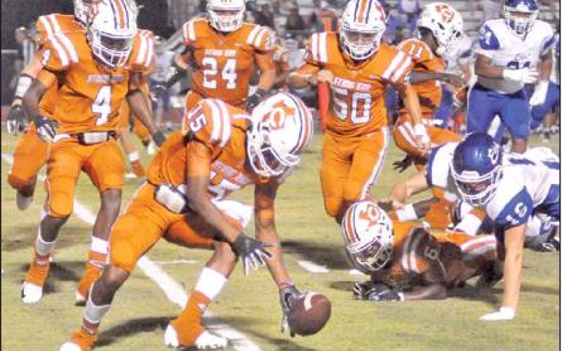 LARRY DAVIS OF THE Caldwell Hornets moves in to recover this fumble last Friday against the Edna Cowboys in Caldwell. The Hornets lost their season opener 29-16 and will face Rockdale this Friday in Rockdale. -- Tribune photo by Roy Sanders