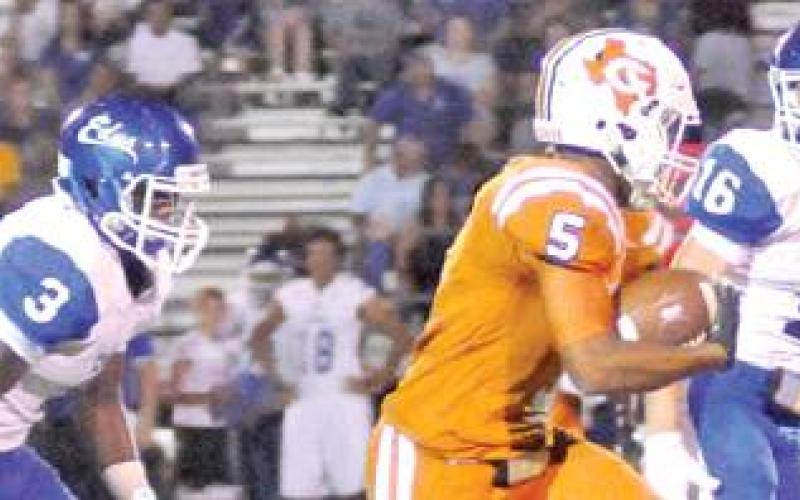 CHRIS CARROLL OF Caldwell breaks through for a long run against Edna last Friday. Carroll rushed for 78 yards on 11 carries in the Hornets’ 29-16 loss. -- Tribune photo by Roy Sanders