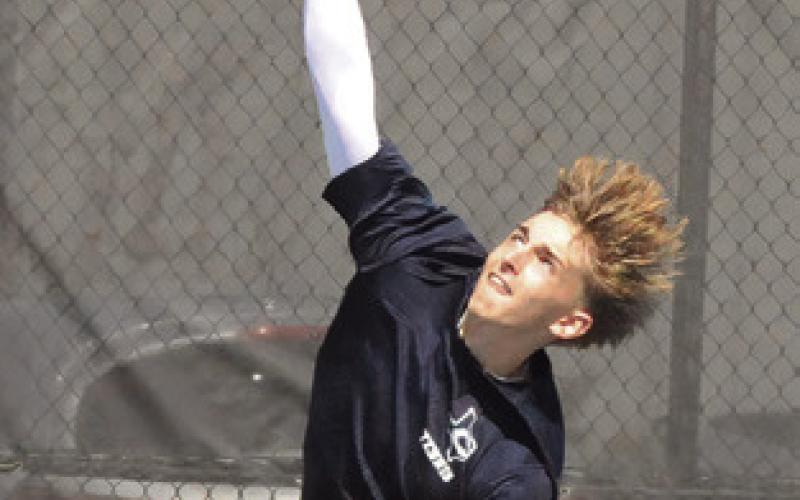 CALDWELL’S DYLAN Chapman serves at the Caldwell Classic Varsity Tennis Tournament. Tribune photo by Denise Squier