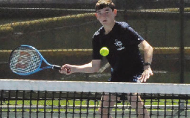 LANDON VYKUKAL sets to hit the ball during mixed doubles match at last week’s Caldwell Classic Varsity Tennis Tournament. Tribune photo by Denise Squier