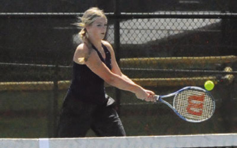 ABBY VOGLER returns serve during mixed doubles match at last week’s Caldwell Classic Varsity Tennis Tournament. Tribune photo by Denise Squier