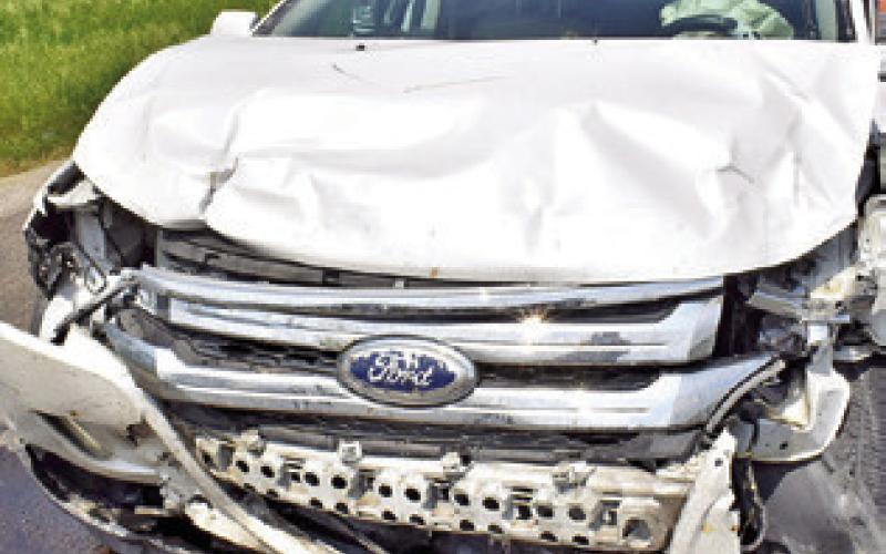 THIS WESTBOUND SUV was damaged in the collision on State Highway 21 West near the F.M. 908 intersection. Tribune photo by Roy Sanders