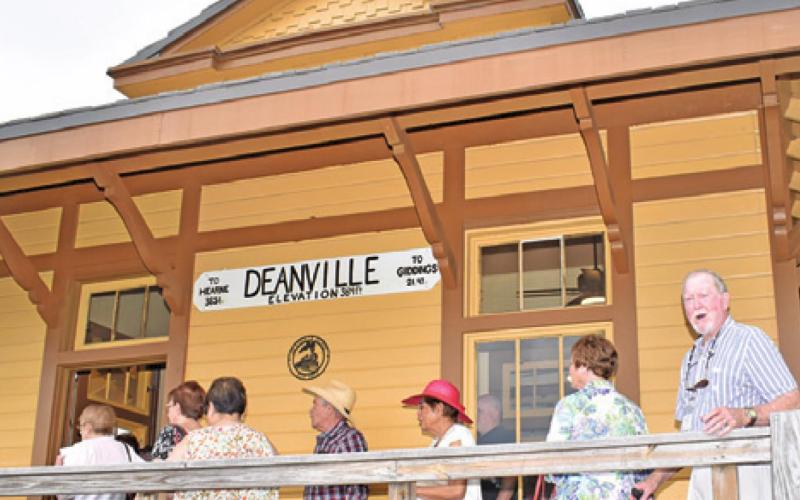 PEOPLE ARE LINED UP to enter the new Deanville Depot Museum.