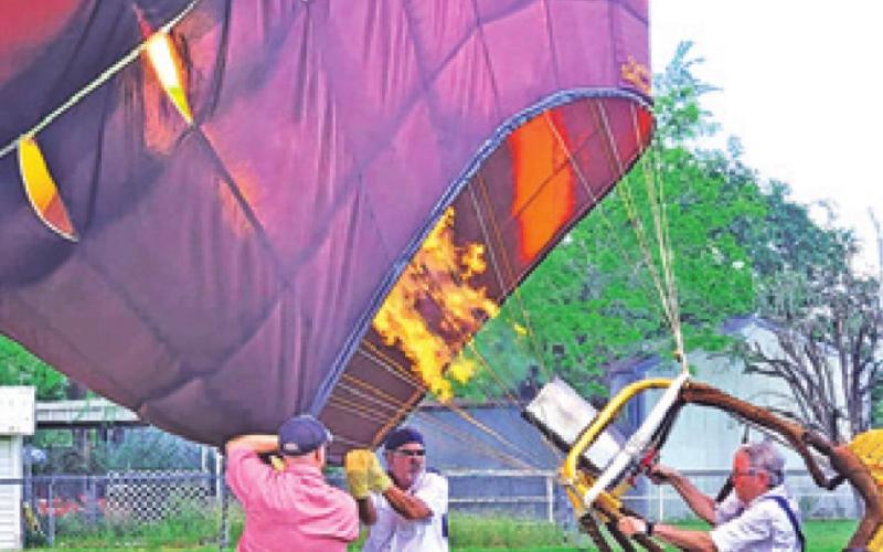 THE HOT AIR BALLOON pilot is getting ready to give rides during Saturday’s grand opening of the Deanville Depot Museum.