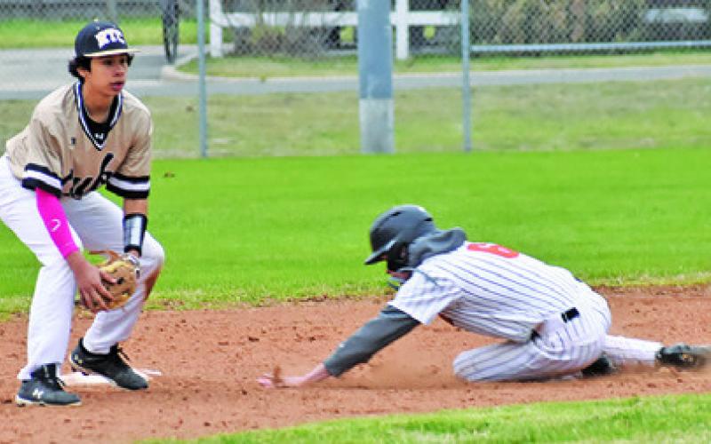 SOMERVILLE’S GAGE TUCK slides into second base against RTC. Tribune photo by Roy Sanders