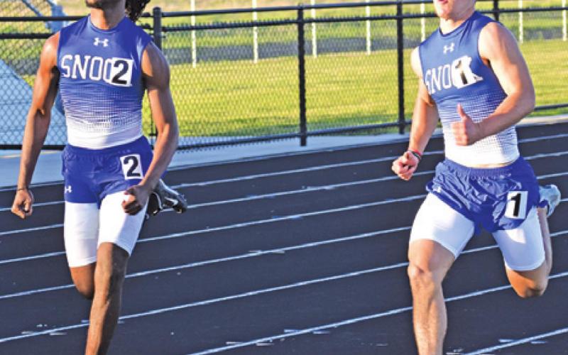 SNOOK’S DALVON WORKMAN and Garrett Lero run in the boys’ 100-meter dash at last week’s Bluejay Relays in Snook.
