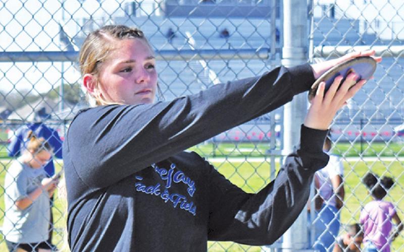 ALEXIS MACIK SETS to throw the discus during the Bluejay Relays last week in Snook. -- Tribune photo by Roy Sanders