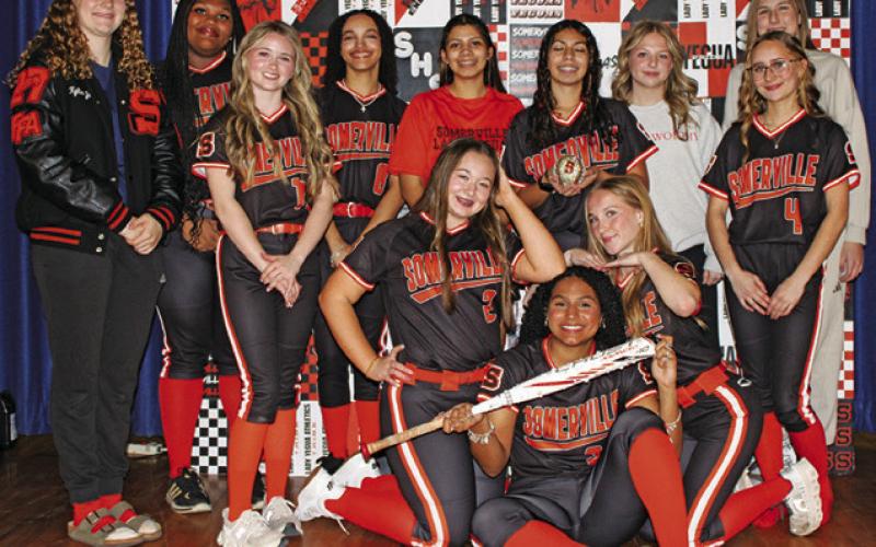 THE 2026 SOMERVILLE HIGH SCHOOL Lady Yegua softball team is, from left, standing, Kylee Neuendorff, Deianca Nix, Rhyan Ricci, Cheyenne Amos, Capri Alejandro, Alexi Alejandro, Audrey Schoenberg, Abigail Richardson (behind), Ryann DeKneef, kneeling, Hadley Howe, Aubrey Flencher and, sitting, Emma Williams.