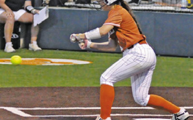 JAELYN GEST BUNTS the ball during the Caldwell-Sealy bi-district game on Thursday. Tribune photo by Denise Squier