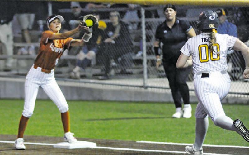 CALDWELL’S JILLIAN VYKUKAL catches the ball for a force out at first base during the Lady Hornets’ bi-district game against Sealy on Thursday at Weiss Field. Tribune photo by Denise Squier