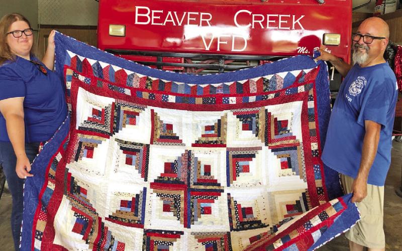 THE CREATIVE MEMORIES QUILT GUILD donated a beautiful quilt to the Beaver Creek Fire Department in Caldwell. Holding the quilt are William Marquez, fire chief and Rebecca Prince. The fire department will use the quilt in their next fundraiser. The Creative Memories Quilt Guild meets on the fourth Wednesday of the month at 9:30 a.m. at the Caldwell Methodist Church on Fox Street. New members are welcome. Photo courtesy of the Creative Memories Quilt Guild