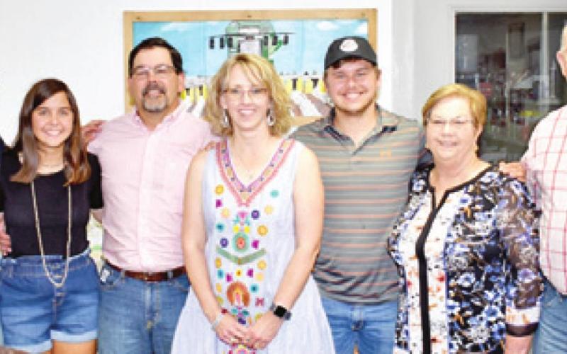 THE STOVALL FAMILY gathers at a Saturday dinner with Scarmardo family members and customers. They include, from left, Caleb Stovall, Sarah Stovall, Leighton Stovall Jr., Jan Stovall, Zach Stovall, Brenda Stovall and Leighton Stovall Sr. -- Tribune photo by Roy Sanders
