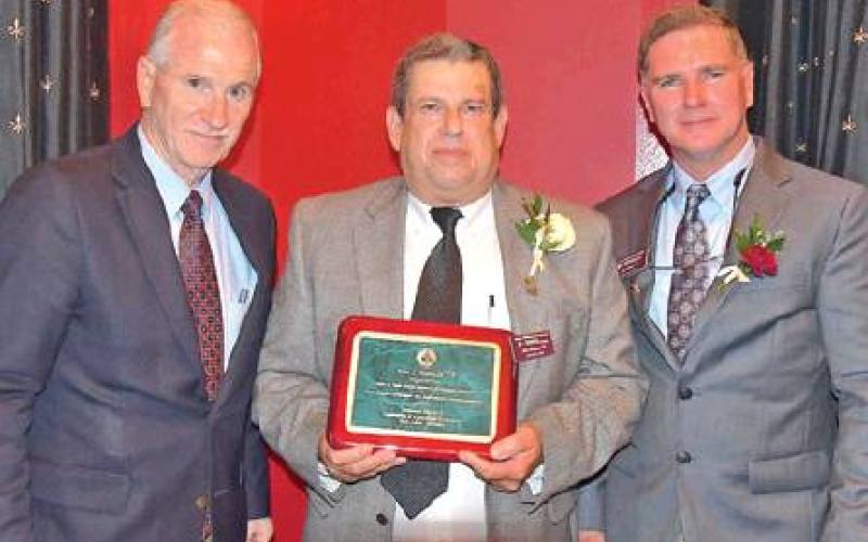 John Malazzo (’78) was recently inducted into the Texas A&amp;amp;M University department of agricultural economics Tyrus R. Timm Honor Registry. Also pictured is (left) Dr. Mark Waller, acting department head, and John Miller (’90). -- Photo courtesty of Texas A&amp;amp;M AgriLife Communications, Blair Fannin