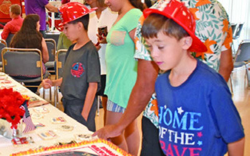 LOCAL YOUTH enjoy the celebration last Wednesday at the Caldwell Fire Station.