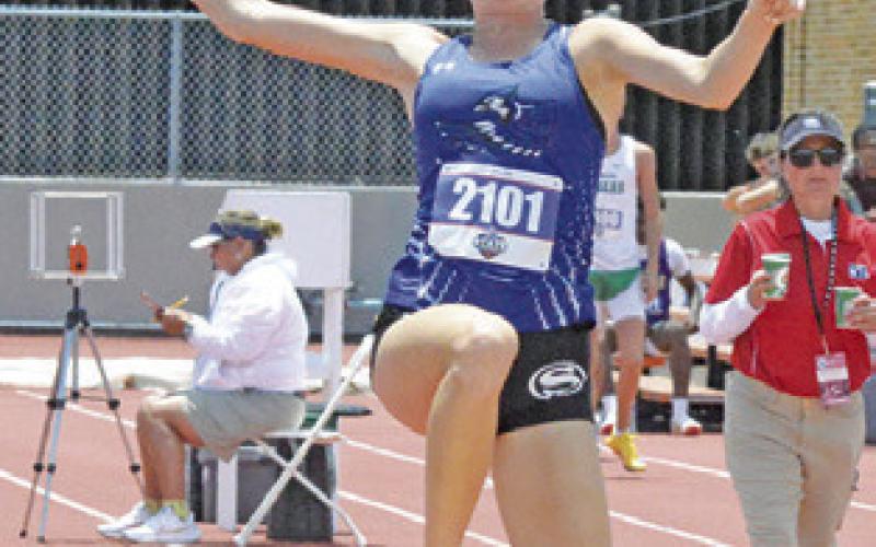 SNOOK’S DAKOTA KIENOW is pictured competing in the Class 2A girls triple jump during the UIL State Track &amp;amp; Field Meet. Kienow and six other Snook athletes have qualified for the TAAF State Championships. Tribune photo by Denise Squier