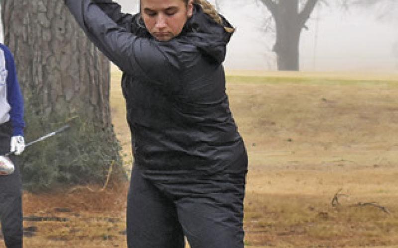 TANZLEY JOHNSON tees off at the Lexington Tournament in Caldwell.