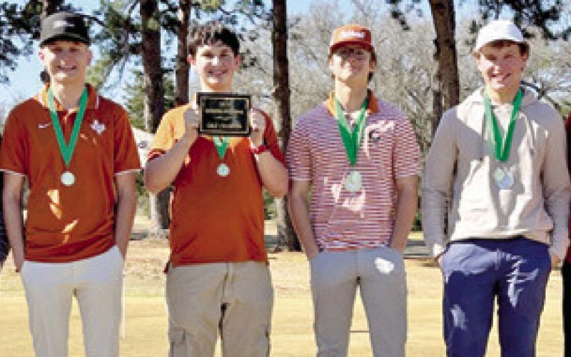 THE CALDWELL HORNETS display their trophy. They include, from left, Cooper Schluens, Cobey McCuller, Jack Gardner, Caden Schluens, Kaden Fritsche and Coach Jacob Schaefer.