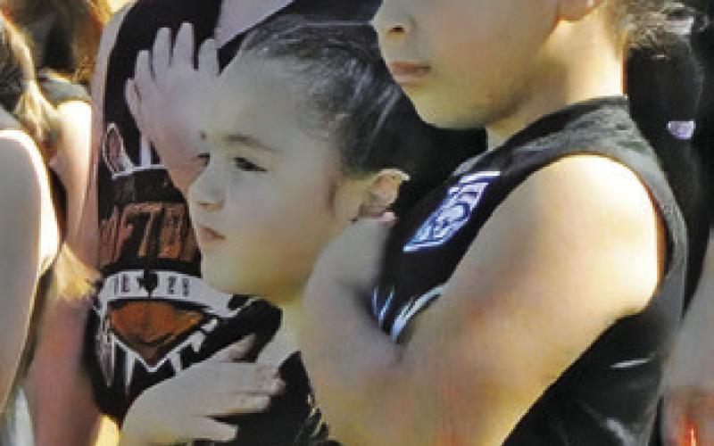 Little League Softball season opened on Saturday with teams announced, the playing of the National Anthem and opening pitches by members of the Texas East Minor League State Champion team.
