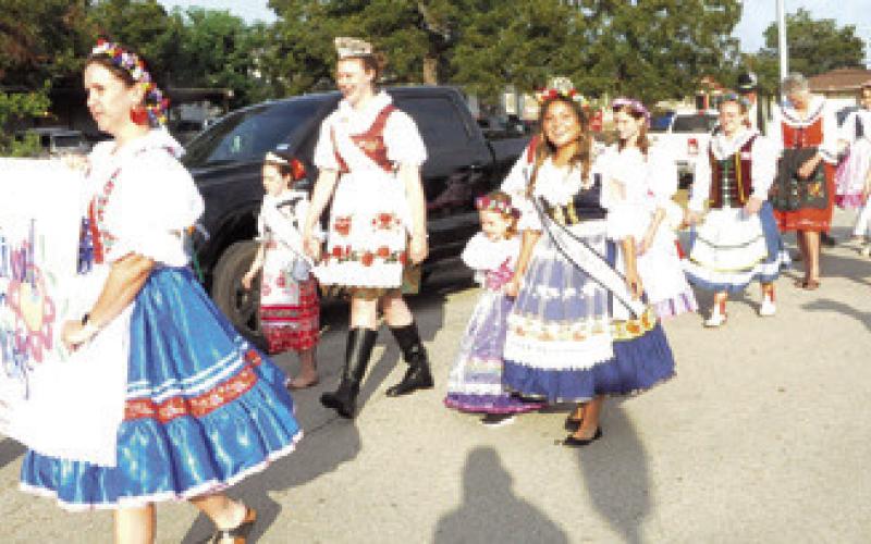 SEVERAL PEOPLE PARTICIPATED in the Kolache Festival’s Parade of Kroje (costumes). Tribune photo by Denise Squier
