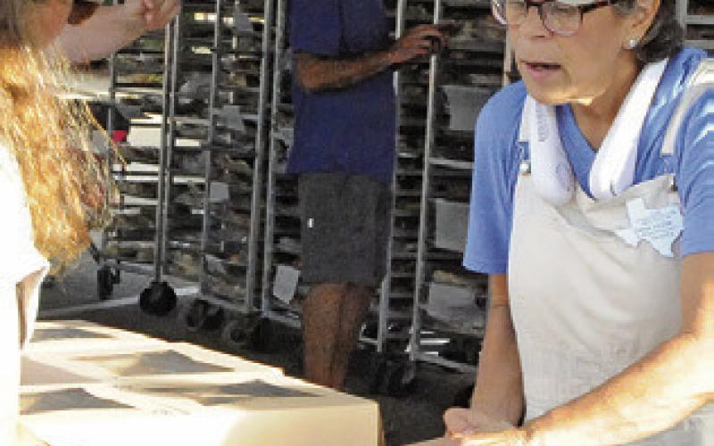 DANA YEZAK SOLD kolaches for Snook EEA during this year’s Kolache Festival in downtown Caldwell last Saturday. Tribune photo by Denise Squier