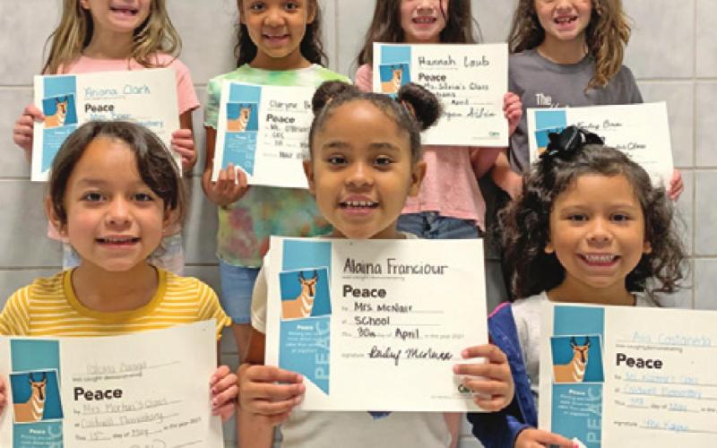 SEVEN KINDERGARTEN STUDENTS at Caldwell Elementary School were recognized with Person of Value for Peace certificates. Pictured are: back row from left, Ariana Clark, Claryne Bell, Hannah Laub, and Kensley Bria; and front row from left, Paloma Zuniga, Alaina Franciour, and Ava Castaneda.