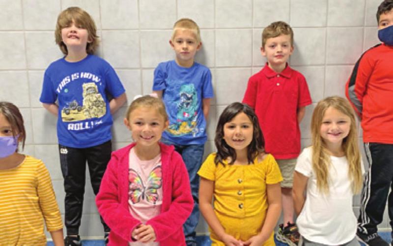 EIGHT FIRST-GRADE students at Caldwell Elementary School were recognized with Person of Value for Peace certificates. Pictured are: back row from left, Jackson Wilder, Carson Burns, Colton Strong, and William Calzada-Cobos; and front row from left, Megan Quiroz, Kelci Campise, Yolanda Espinosa, and Aubrey Maurer.