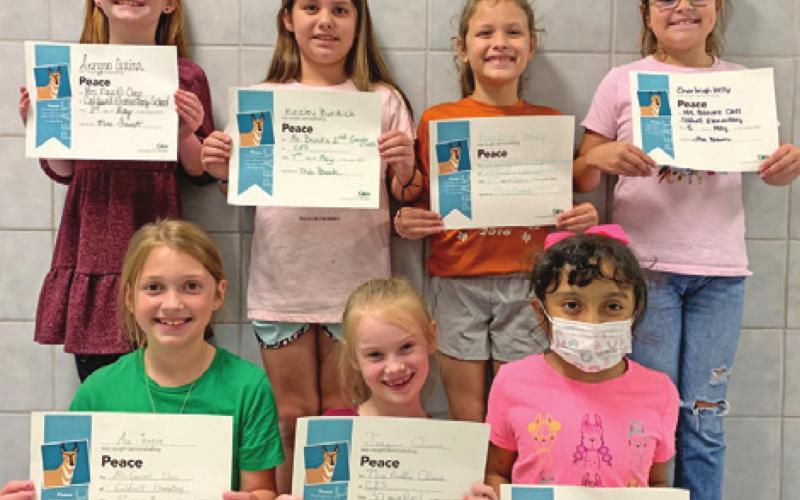SEVEN SECOND-GRADE students at Caldwell Elementary School were recognized with Person of Value for Peace certificates. Pictured are: back row from left, Aerynn Quinn, Kinzley Bundick, Kambree Toney, and Charleigh Kelly; and front row from left, Ava Teague, Teagan Quinn, and Danna Aldaba.