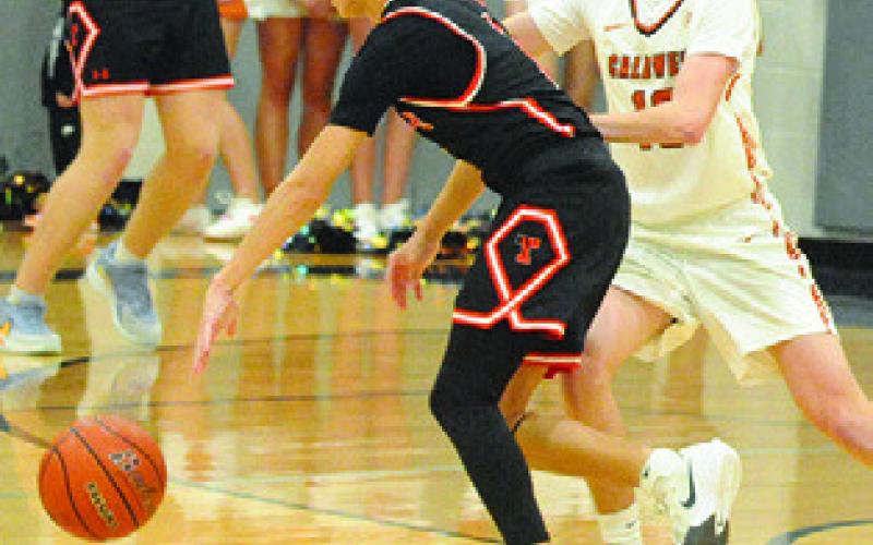 LOGAN COLBERT OF Caldwell plays defense in the victory over Smithville. Tribune photo by Denise Squier