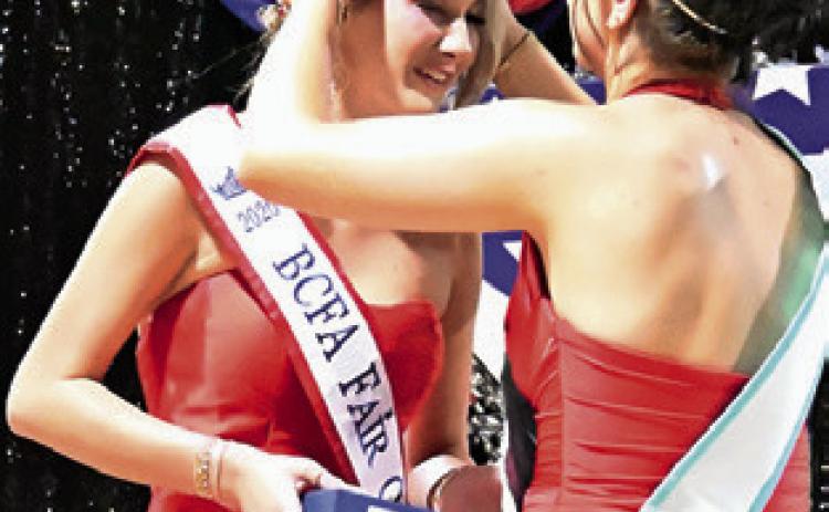 2025 BURLESON COUNTY Fair Queen Kodi Hitchcock places the crown on the 2026 Burleson County Fair Queen Jolee Telschow. The Fair Queen contest was Sunday night, Sept. 20, at the Burleson County Fairgrounds. Tribune photo by Denise Squier