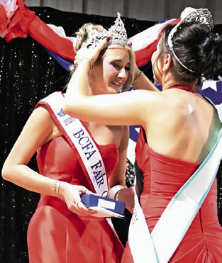 2025 BURLESON COUNTY Fair Queen Kodi Hitchcock places the crown on the 2026 Burleson County Fair Queen Jolee Telschow. The Fair Queen contest was Sunday night, Sept. 20, at the Burleson County Fairgrounds. Tribune photo by Denise Squier