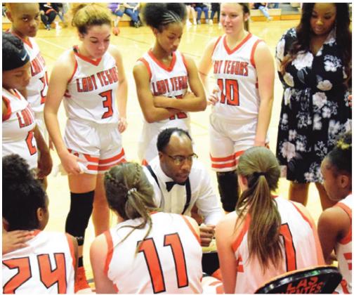 SOMERVILLE HEAD GIRLS coach Jeremy Montgomery talks to the Lady Yeguas during a timeout at Friday night’s home game against Burton. Somerville won 74-14. -- Tribune photo by Denise Hornaday