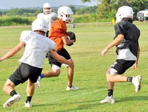THE CALDWELL HORNETS work on their offense during this Friday workout at the high school. Caldwell will scrimmage Waco Robinson this Friday at home. -- Tribune photo by Roy Sanders