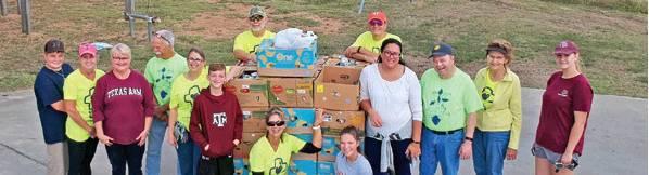 PANTRY VOLUNTEERS WITH Elizabeth Lutheran Church in Caldwell gather during week three of the food drive. The classes at First Baptist School in Caldwell recently collected some non-perishable donations for the pantry, and their work was appreciated.