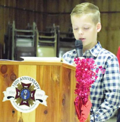 HUDSON NOVOSAD read his sister Hadleigh’s winning Patriot Pen essay during an awards presentation at the Caldwell VFW Post No. 4458. -- Tribune photo by Denise Hornaday