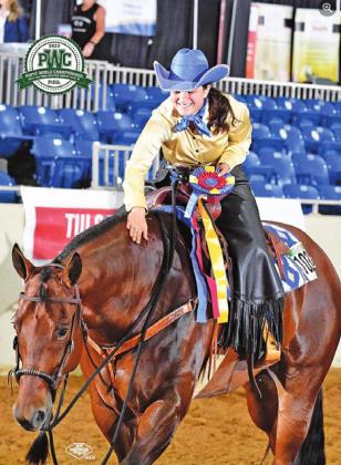 SABINE LAZO CELEBRATES with Hes Styled (“Stylz”) after winning the Open Western Dressage, Intro Level Test 3 title at the 2022 Pinto World Championship Show in Tulsa, Oklahoma, last week. -- Photo courtesy of Jeff Kirkbride Photography and PtHA
