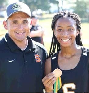 SOMERVILLE’S RAMAYA Carter finished fifth in the girls junior varsity division at the Lexington Small School Showdown Cross Country Meet on Saturday, Sept. 7. She is pictured with her coach Billy Ramey.
