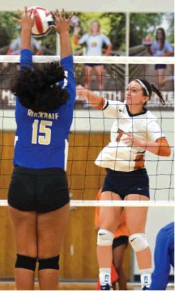 CALDWELL’S JACEY VYKUKAL kills the ball, hitting it through the outstretched arms of a Rockdale blocker Friday at Hornet Gym. Vykukal had seven kills in the win. -- Tribune photo by Denise Hornaday