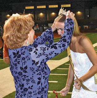 CHS ALUMNA STEPHINA DiDonato, Class of 1951, crowns this year’s CHS Homecoming Queen, Lucy Ferguson. Tribune photo by Roy Sanders