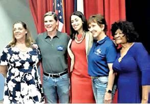 DEMOCRATIC PARTY Chairwoman Linda Arbuckle, left, and Mable Davis, right, join Rick Kennedy, Amanda Edwards and Barbara Gardner at the Taco Town Hall Meeting.