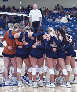 THE LADY HORNETS HUDDLE at the Leon Tournament last week.