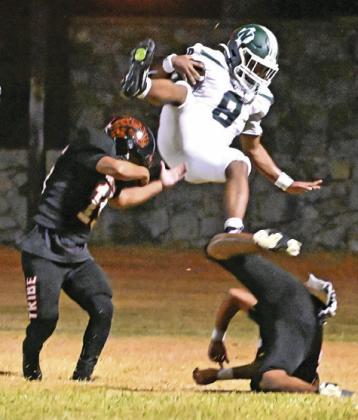 SOMERVILLE PLAYERS DEFEND as this Normangee receiver makes a catch last Friday in Normangee’s 35-16 win at Somerville. Tribune photo by Denise Squier
